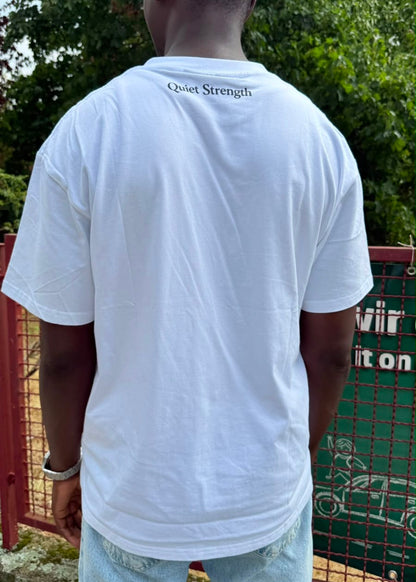 Model wearing the white SAKHO Quiet Strength Tee, back view with Quiet Strength detail